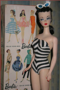 Image of first edition brunette Barbie doll made by Mattel in 1959.