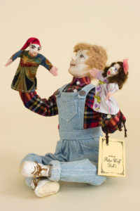Photo of OOAK doll Boy with puppets by doll artist Peter Wolf.