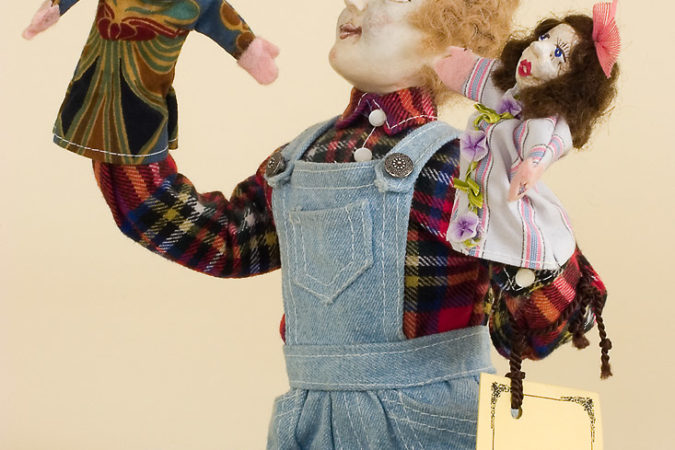 Photo of OOAK doll Boy with puppets by doll artist Peter Wolf.