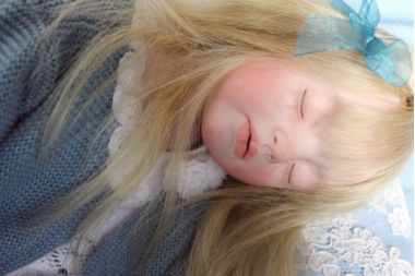 Close up photo of Sleeping Girl doll by Elisa Gallea showing face detail.