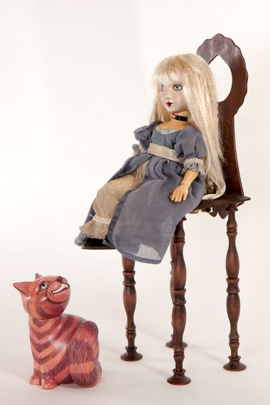 Detail view of Alice and Cheshire Cat with chair set wood dolls by Marlene Xenis
