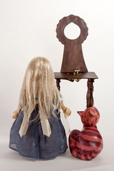Detail view of Alice and Cheshire Cat with chair set wood dolls by Marlene Xenis