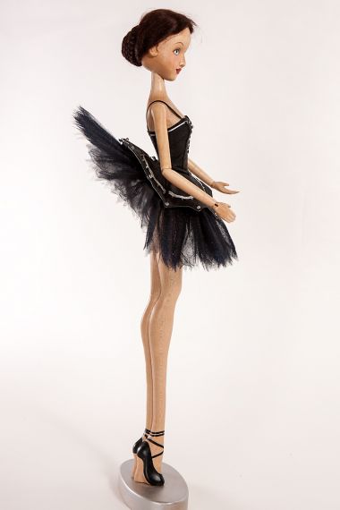 Photo of Black Swan Prima Ballerina posable wood art doll by artist Marlene Xenis.